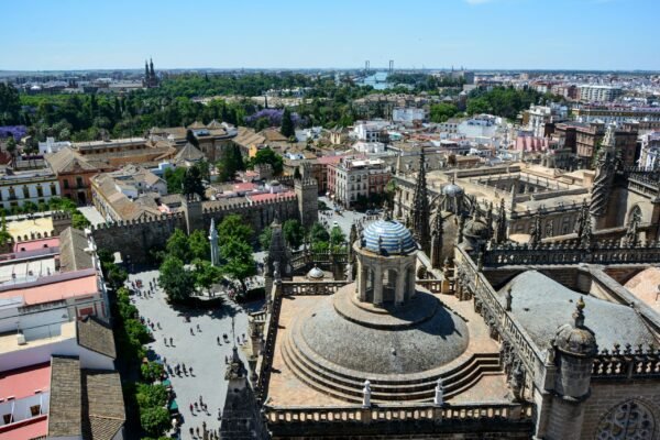 Stunning aerial view of Seville Cathedral with the cityscape of Seville, Spain on a sunny day.