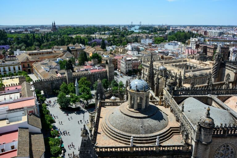 Stunning aerial view of Seville Cathedral with the cityscape of Seville, Spain on a sunny day.